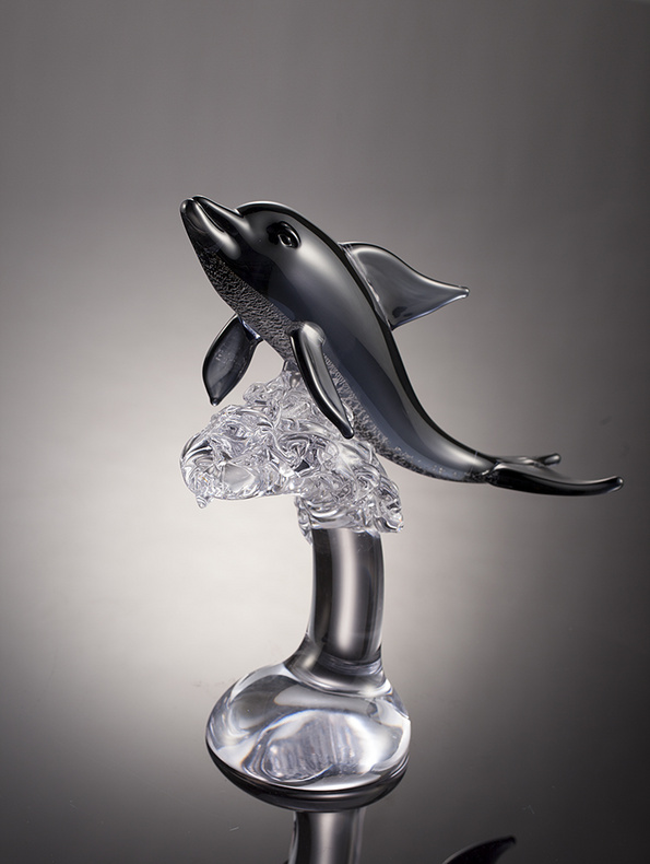 Crystal glass crafts dolphin with its head held high